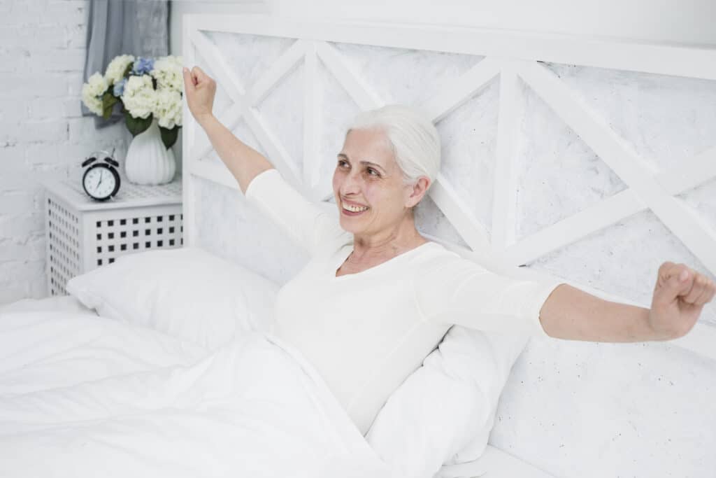 elder woman waking up bed 2